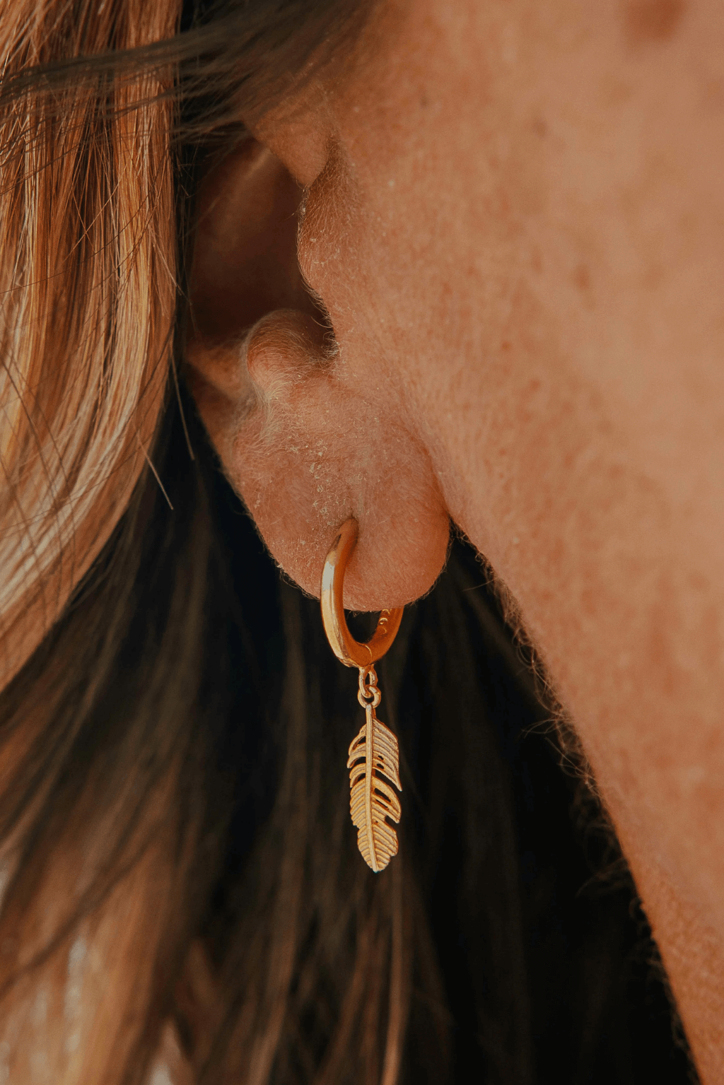 Gold feather hoop earrings discount